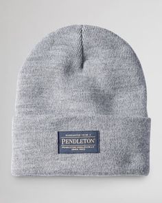 A Classic Beanie In A Soft, Stretchy Ribbed Knit With Pendleton Logo Patch On The Turn-Back Brim. Acrylic Hand Wash Made In USA Of Imported Material | PENDLETON BEANIE Classic Fitted Beanie For Cold Weather, Classic Fitted Knitted Beanie, Casual Fitted Ribbed Hat, Classic Beanie For Cold Weather, Classic Fitted Soft Knit Hat, Classic Gray Hats For Cold Weather, Casual Fitted Beanie For Outdoor, Classic Beanie With Ribbed Cuffs, Classic Cotton Hats For Cold Weather