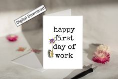 a white card with the words happy first day of work on it next to flowers