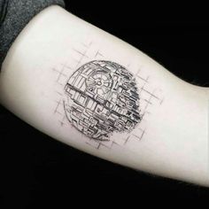 a man's arm with a star wars tattoo on it