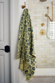 Block printed floral print waffle weave bath towel hanging on a hook Khadi Fabric, Floral Bath Towels, Green Bath Towels, Hand Towels Kitchen, Floral Bath, Cotton Bath Towels, Block Printing, Waffle Weave, Mahatma Gandhi