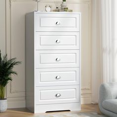 a white chest of drawers in a living room