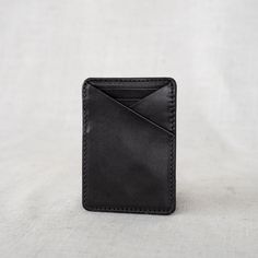 This Money Clip Wallet is perfect for the guy who loves to carry cash and a few cards. It's modern and sleek, and designed to hold the basics. Made with durable, full-grain leather, he'll love this purchase for years to come. Modern Rfid Blocking Wallets, Minimalist Wallets With Card Slots For Travel, Everyday Rectangular Wallet With Rfid Blocking, Minimalist Travel Wallets With Card Slots, Minimalist Travel Wallet With Card Slots, Black Minimalist Trifold Wallet For Everyday Use, Everyday Trifold Card Holder With Smooth Grain, Modern Leather Card Holder With Phone Sleeve, Casual Bifold Card Holder For Everyday Use