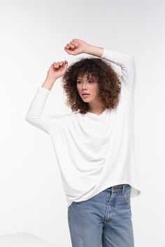 Comfortable soft cotton viscose tunic with 3/4 sleeve and a loose design. Boat neckline and casual goth vibe - this tunic is perfect for your everyday style.The model in the picture is 176cm. ⅼ 5.8 ft. tall and is wearing size S / color: Off white🌟 INFO:• Worldwide EXPRESS shipping – please provide a phone number for shipping documents• US Sizing XS to 4XL – body size chart available below• We offer customization to Personal Measurements & Larger Sizes 5XL, 6XL, 7XL ….🌟 MATERIAL & CARE Asymmetrical Viscose Top For Spring, Lagenlook Flowy Long Sleeve Blouse, White 3/4 Sleeve Tops For Layering, Flowy Long Sleeve Lagenlook Blouse, Casual Flowy Tops With Asymmetrical Hem, Versatile Slouchy Long Sleeve Tops, Casual Viscose Tunic Top, Flowy Lagenlook Top For Fall, Modern Summer Tops With 3/4 Sleeve