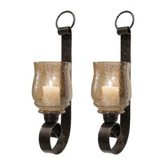 two wall sconces with candle holders attached to them