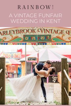 a bride and groom kissing in front of an old fashioned fairground sign with text overlay reading, vintage funfair wedding in kent