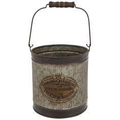 an old fashioned metal bucket with handle