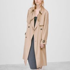 Aritzia Babaton Trench Coat In Size Xs. Drapey, Lightweight, And Slightly Roomy Fit. Classic Trench Coat In A Neutral Tan Color, Featuring: Epaulettes, Pockets, Belted Cuffs, Double Breasted Buttons, Adjustable/Removable Belt, Back Vent, Partially Lined. Worn Less Than 5x, No Rips Stains Or Flaws. A Little Wrinkled From Being Stored In The Closet. Approximate Measurements: Center Back To Bottom Hem: 42.5” Sleeve Length From Shoulder Seam: 22.5” Shoulder To Shoulder: 17” Beige Belted Outerwear For Daywear, Double-breasted Outerwear For Fall Daywear, Casual Gabardine Outerwear For Office, Chic Brown Gabardine Outerwear, Brown Gabardine Fall Outerwear, Brown Gabardine Outerwear For Fall, Neutral Outerwear For Fall Daywear, Beige Outerwear For Fall Daywear, Beige Lapel Collar Outerwear For Daywear