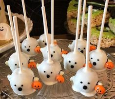 halloween cake pops with ghost faces and jack - o'- lanterns on them