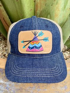 Ladies Cap Denim/Tan/Purple/Blue Tan Mesh Back Hand Tooled & Painted Leather Teepee Patch Casual Multicolor Flat Brim Baseball Cap, Casual Outdoor Baseball Cap With Leather Patch, Casual Purple Baseball Cap With Curved Bill, Purple Adjustable Trucker Hat, Adjustable Blue Denim Trucker Hat, Casual Trucker Hat With Leather Patch, Adjustable Denim Trucker Hat With Curved Brim, Casual Purple Adjustable Trucker Hat, Adjustable Denim Snapback Trucker Hat