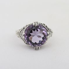 Vintage Sterling Silver Natural Amethyst Filigree Ring ...Marked 925...Total of weights 3.1grams...Size 7...Measure of Face 13MM...It's in very good condition. Sterling Silver Amethyst Ring With Accent Stones, Classic Purple Sterling Silver Ring, Classic Sterling Silver Amethyst Ring With Center Stone, Classic Round Purple Crystal Ring, Classic Purple Crystal Round Ring, Sterling Silver Amethyst Ring With Center Stone, Classic Purple Crystal Ring, Heirloom Style Amethyst Ring In Sterling Silver, Classic Purple Round Crystal Ring