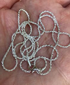 "Genuine 925 Sterling Silver 1.5mm, Rope Chain ✽ Material: .925 Sterling Silver- Made in Italy well made, 1.5mm Medium Width Rope style chain ✽ Length : 16 inches, 18 inches, 20 inches, 22 inches, 24 inches, 30 inches ✽ Finished with strong, Lobster or Spring ring clasp. Stamped \"925\" for authenticity. ✽ Beautiful worn by itself or add your favorite Charm, Pendant or Medallion SHOP Forever Memory Designs: http://www.etsy.com/shop/ForeverMemoryDesigns Tags: Genuine, Solid, Pure, Real, Authentic Silver Link Rope Chain Necklace Gift, Silver Rope Chain Necklace With Cable Chain For Gifts, Silver Cable Chain Rope Necklace Gift, Silver Cable Chain Rope Necklace For Gifts, Silver Rope Chain Necklace Gift, Silver Rope Chain Necklace As A Gift, Silver Snake Chain Necklace With Lobster Clasp, Memory Design, Silver Rope Chain