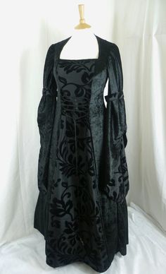 This listing is for a custom made dress,it will be made to the measurements you send me. Please send me your bust,waist and hip measurements,and please measure from the top of your shoulder to the floor with shoes on. It will be made with beautiful jet black crushed velvet and stunning black flocked taffeta....this fabric will also line the inner sleeves.It has a corset style front and back with lacing so you can adjust the dress to fit your body shape. Combined shipping on multiple items. If yo Gothic Fitted Gown For Fancy Dress, Elegant Black Gown For Fancy Dress, Fitted Gothic Gown For Fancy Dress, Fitted Black Ball Gown For Costume Party, Fitted Dress With Customizable Length For Banquets, Fitted Ball Gown Corset Dress For Banquet, Fitted Gown With Corset Back For Banquet, Fitted Gown With Corset Back For Banquets, Gothic Evening Dress With Fitted Bodice