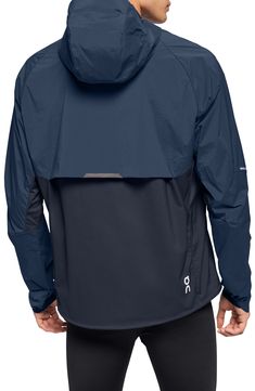 Enjoy the versatility of a lightweight, wind-resistant running jacket designed with a stay-put hood and secure zip pockets. 28 1/2" length (size Medium) Front zip pockets Drawstring hood Partial elastic cuffs with top extension On-seam zip pockets Drawstring hem Packs into pocket Reflective details enhance visibility in low light or at night Lined 87% Recycled polyamide 13% elastane Machine wash, tumble dry Imported Sportswear Details, Running Apparel, Winter Running, Sports Graphic Design, Jackets Men Fashion, Light Knit, Running Jacket, Water Repellent Fabric, Saint Bernard