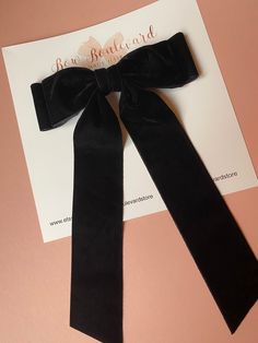 "Handmade double layer large velvet bow attached to a large alligator clip.  Bow measures approx 7\" wide x 10\" long This classic elegant black velvet bow compliments every outfit. It also makes a perfect gift." Elegant Bow With Black Ribbon, Chic Evening Bow With Detachable Feature, Chic Decorative Bow For Black Tie Events, Chic Black Ribbon Bow For Formal Events, Black Ribbon Bow For Evening, Elegant Black Bow With Tie Back, Formal Black Ribbon Bow, Chic Black Bow For Black Tie Events, Chic Party Bow Tie With Ribbon