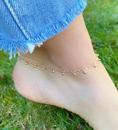 Solid 14K Gold Ball & Chain Anklet. The Perfect Body Jewelry, The Gold Balls Are Dangly Making It The Perfect Accessory. A Beautiful Gift To Give Yourself Or To Others. Jewelry Comes In A Cute Gift Box Ready To Present. -Jewelry Is New And Inspected For Quality Assurance. -Jewelry Is Crafted In Genuine High Quality 14K Gold. -We Do Not Sell Gold Plated. Product Detail: Metal: 14k yellow gold Weight: 2.8 grams Length: 9 inch + 1 inch Closure: spring clasp Style: dangling gold ball anklet -Fee Gold Tarnish Resistant Anklets For Gifts, Elegant Gold Anklets In 14k Gold Filled, Elegant 14k Gold-filled Gold Anklets, Gold Anklets As Gift, Gold 14k Gold Filled Anklets For Gift, Gold 14k Gold Filled Anklets As Gift, Gold 14k Gold-filled Anklets As Gift, 14k Gold Filled Anklets As A Gift, Dainty 14k Gold Anklets