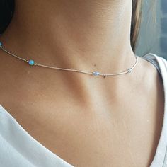 Gold filled, Sterling Silver or Rose Gold necklace with a dainty lab opal beads. Colors - white, dark blue, light blue, green or pink. You can wear everyday, alone or layer with more necklaces. This necklace is perfect for yourself, giving as a special gift, or bridesmaid necklace***CHOKER LENGTH:X SMALL 12-14 INCH + 1.5 INCH EXTENSIONSMALL  13-14 INCH + 1.5 INCH EXTENSIONMEDIUM 14-16 INCH + 1.5 INCH EXTENSIONLARGE 16-17.5 INCH + 1.5 INCH EXTENSION If you would like this chain altered, please co Delicate Silver Opal Necklace, Dainty Adjustable Opal Necklace, Minimalist Opal Jewelry With Delicate Chain, Dainty Opal Adjustable Necklace, Delicate Silver Opal Jewelry, Silver Opal Necklace In Dainty Style, Silver Opal Dainty Necklace, Silver Opal Minimalist Necklace, Minimalist Opal Necklaces With Delicate Chain