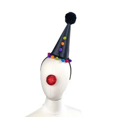 "This classic clown hat is perfect for plays, burlesque acts, vaudeville, you name it- any time you need that perfect retro look. it stands 8\" inches high. It is made with a buckram and wire base and had been covered in two layers of fabric, the top being a black. It has sequins and pom poms on the base, up the front, and a handmade pom pom in black tops it off. It slides on to a black satin headband and you can position it any way you want. I use only the most comfortable headbands around. One Novelty Carnival Hat Costume Accessory, Novelty Top Hat For Carnival Costume Party, Novelty Adjustable Headpiece For Carnival, Novelty Hat For Carnival, Novelty Carnival Costume Hat, Adjustable Novelty Headpieces For Carnival, Carnival Novelty Costume Hat, Adjustable Mini Hats For Costume Party At Carnival, Adjustable Mini Hats For Carnival Costume Party