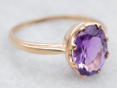 Adorn yourself with this stunning amethyst solitaire cocktail ring crafted from exquisite two-tone yellow and rose gold. Boasting a unique and eye-catching design, this luxurious piece is sure to make a statement.Metal: 14K Yellow and Rose GoldGem: Amethyst 2.51 CaratsGem Measurements: 8.6 x 11.1 mm, OvalRing Size: 10.50Marks: "BROGAN 14K" Stamped on the inside band Elegant Yellow Gold Amethyst Ring With Bezel Setting, Elegant Gold Solitaire Amethyst Ring, Elegant Rose Gold Solitaire Amethyst Ring, Elegant Purple Amethyst Ring With Bezel Setting, Elegant Purple Amethyst Bezel Setting Ring, Elegant 14k Gold Amethyst Ring With Polished Finish, Elegant 14k Gold Amethyst Ring With Bezel Setting, Luxury Oval Solitaire Amethyst Ring, Amethyst Cocktail Ring