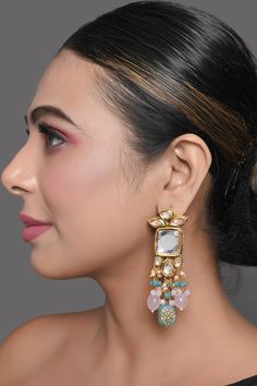 Embellished With Kundan Work & semiprecious tanjore beaded , adorn these earrings For A Classic Look. Product Features: Color: Pastel blue & Pink beaded Handcrafted Kundan earrings Material: Metal copper alloy with semiprecious tanjore beads work : kundan with meenkari on back side Dimension: Length - 3.6in, Width - 1.1in Pack Of: Pair of earrings Occasion: festive and wedding Disclaimer: There will be slight difference in digital to actual image Temple Jewelry Beaded Earrings For Parties, Temple Jewelry Chandbali Beaded Earrings, Temple Jewelry Beaded Earrings For Festivals, Festive Beaded Dangle Earrings, Festive Beaded Earrings For Gift, Multicolor Beaded Temple Jewelry Earrings, Traditional Beaded Drop Bridal Earrings, Festive Beaded Earrings With Dangling Beads As Gift, Beaded Chandbali Danglers For Gifts