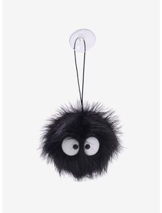 a black furry ball hanging from a hook