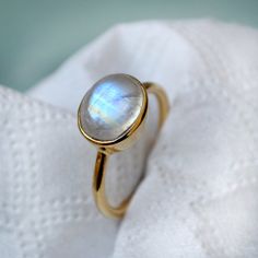 Rainbow Moonstone gold ring, 14k yellow gold Moonstone ring, Moonstone jewelry, beautiful gold ring, gift for her, Oval cabochon stone The 14K yellow solid gold bezel and solid yellow gold ring are both shined to an extremely high polish. All rings are packaged and shipped in a beautiful ring box. The main stone is natural, fire, Rainbow Moonstone. Gemstone Size Approx : 10 x 8 mm The pictures have been enlarged to show the details. The price is for a 14k gold ring, if you want to order the ring Yellow Gold Moonstone Ring, Beautiful Gold Rings, Gold Moonstone Ring, Ring Moonstone, Fire Rainbow, Cocktail Jewelry, Artisan Rings, Jewelry Beautiful, Blue Moonstone