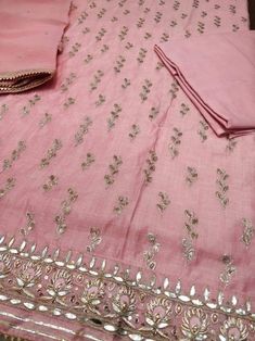 Item Overview ATHARVA Hand Embroidered Salwar Kameez in Pink w/ All Over Jaal w/Embroidered Border/ Gota Chandla Dupatta/Custom Stitching/Wedding/CH Dno. CH Fabric: * Shirt Chanderi 2.5 Mts, Pink Jaal Embroidery * Dupatta: Pure Chiffon Chinnon/ Dupatta with Gota Patti work 2.5 Mts. * Bottom Santoon Silk 2.5 Mts. Excusive Hand Embroidered Party Wear Punjabi Suit. Customization: * Fabrics: Designs Can be made in different Fabrics. * Stitching Available Care: * Dry Clean/ Avoid direct Ironing on Em Embroidered Suits, Embroidered Salwar, Embroidery Suits Punjabi, Embroidered Kurti, Gota Work, Embroidery Tshirt, Embroidery Sweater, Embroidery Shoes, Beginner Sewing