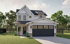 a two story house with a black garage door