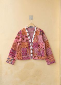 Indian Handmade Patchwork Cotton Quilted Jacket, Vintage Peach New Style V-Neck Cotton Quilted Jacket, Reversible Women's Boho Coat Size Chart- Medium Size- CHEST- 40 INCHES LENGTH- 23 INCH SLEEVE- 22 INCH Large Size- CHEST- 42 INCH LENGTH- 23 INCH SLEEVE- 22 INCH XL Size- CHEST- 44 INCHES LENGTH- 23 INCHES SLEEVE- 22 INCHES XXL Size- CHEST- 46 INCHES LENGTH- 23 INCHES SLEEVE- 22 INCHES NOTE- AS THE JACKETS ARE HANDMADE, EXPECT A SIZE VARIATION OF +-0.5 INCHES. Color- Peach Multi Color Festive Multicolor Long Sleeve Outerwear, Festive Long Sleeve Multicolor Outerwear, Winter Festival Cardigan With Patchwork, Festive Pink Long Sleeve Outerwear, Festive Patchwork Long Sleeve Outerwear, Pink Patchwork Cardigan For Winter, Pink Long Sleeve Outerwear For Festivals, Winter Festival Patchwork Cardigan, Festive Long Sleeve Patchwork Outerwear