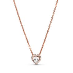 Make a statement with the Sparkling Heart Collier Necklace. Hand-finished in 14K rose gold-plating, this necklace is inspired by classic design elements from the Pandora Timeless collection. Featuring a raised heart-shaped central cubic zirconia surrounded by a halo of clear cubic zirconia, a Pandora crown O monogram logo tag is attached by the clasp. Adjust the necklace length to suit your style and wear with other heart-shaped pieces for a look filled with love. O Monogram Logo, O Monogram, Logo Tag, Monogram Logo, Necklace Length, Gold Plating, Rose Gold Plates, Design Elements, Classic Design