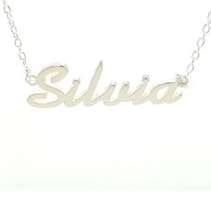 LittleGoldDaisy is a US Company. Silvia - Sterling Silver personalized Name Necklace on beautiful Italian 16" Trace Chain. Personalized in script font style with name - Silvia -.  Comes complete with superior Mirror Polish and in presentable gift box. Description: Sterling Silver 925 (solid not plated) Personalized Name Necklace Name: Silvia Thickness: 1mm solid Silver Chain Type: Rolo/Trace Chain in Sterling Silver Chain length: 16 inches For ANY Personalized / Customized Name other then this l Popular Script Fonts, Name Plate Necklace, Necklace Pendent, Light System, Plate Necklace, Pendent Necklace, Font Style, Script Font, Sound System