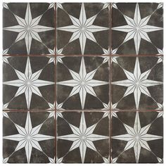 a black and white tile with stars on it