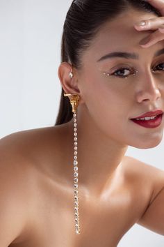 22k gold plated, 925 silver base ear cuffs handcrafted with carved work horse detailed top and white Swarovski stone embellished long tassel. - Aza Fashions Diamond Clip-on Jewelry For Parties, Fine Jewelry Clip-on Earrings For Party, Elegant Dangle Ear Cuff For Party, Long Drop Diamond Jewelry For Party, Long Drop Diamond Party Jewelry, White Gold Clip-on Earrings For Party, Luxury Wedding Ear Cuff For Pierced Ears, Evening Crystal Single Earring, Luxury Ear Cuff For Pierced Ears For Formal Occasions