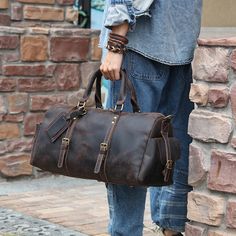 Easy to pack,holds a lot,stylish to carry.Woosir’s black leather travel duffle bag has what it takes to be the only travel bag you’ll need.This leather travel bag offers plenty of room to hold what you need for an overnight trip or a 3-day adventure.     ITEM OVERVIEW   Size: 52.5 x 25 x 25.5cm(L x W x H), attached with a long strap with adjustable length, the size is perfect for a long or short-trip.    Made from high-quality genuine leather, smooth zip, strong stitching, polished hard work, safe, strong, durable, zip closure, belonging to a small bag.    Its capacity exceeds your imagination and can accommodate a wide range of daily necessities, making it practical and convenient. Hand-held thickening and decompression design reduces stress on the hand and makes it easier to carry out Travel Leather Backpack With Luggage Sleeve, Large Capacity Leather Travel Bag For Weekend Trips, Large Capacity Leather Duffle Bag For Trips, Soft Leather Satchel Duffle Bag For Travel, Leather Shoulder Duffle Bag For Trips, Leather Shoulder Duffle Bag For Travel, Soft Leather Satchel For Weekend Trips, Soft Leather Travel Bag For Trips, Leather Backpack Duffle Bag For Travel