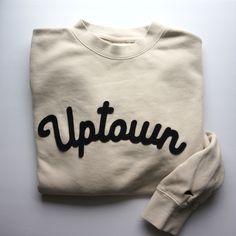 "The perfect vintage style sweatshirt that's already broken in with top stitched felt lettering. - This ivory unisex crewneck sweatshirt is so cozy and has that perfect, \"been washed 100 times\" look! The lettering is black wool felt top stitched to secure it to the front of the sweatshirt. Left sleeve has a cute embroidered pennant  ;) - Unisex sizing means that for WOMEN I recommend ordering a size smaller than your standard size or for an oversized look order your standard size. - Unisex siz Cream Crew Neck Sweatshirt For Winter, Everyday Cream Crew Neck Sweatshirt, Beige Cotton Sweater With Letter Print, Cozy Cream Cotton Sweatshirt, Vintage Crew Neck Sweatshirt For Everyday, Vintage Crew Neck Everyday Sweatshirt, Beige Letter Print Sweatshirt For Loungewear, Cream Relaxed Fit Crew Sweatshirt, Simple Crewneck Design