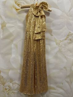 Gorgeous gold sequins jumpsuit, romper with bow.  Zipper back.   Fabric: sequins. Ready to ship in size 5-6 (measurements on the photos). Gold Sleeveless Sequin Fabric For Party Season, Gold Sequin Fabric For Party Season, Glamorous Sequined Jumpsuits And Rompers For Party Season, Fitted Sequin Jumpsuits And Rompers For Prom, Embellished Jumpsuits And Rompers For Party Season, Glamorous Gold Sequin Fabric For Prom Season, Sequin Jumpsuits And Rompers For Party Season, Gold Party Jumpsuit With Sequins, Glamorous Gold Jumpsuits And Rompers For Party Season