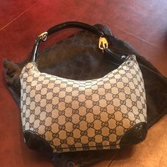 Absolutely Authentic Gucci Black And Grey Gucci Hobo Bag With Patent Leather Handle And Corners. Purchased In Naples Italy In 2003. This Style Is Rare And I Have Never Really Seen Anyone Else With It. There Is A Small Scrape In The Canvas (See Photo) On On Side Approx 3.5” Long By 1/2” Wide. I Am Not Sure How That Happened. Other Than That The Bag Is In Very Good Condition And Interior Is Mint. Comes With Dustbag. Elegant Gucci Monogram Canvas Bag, Elegant Pre-owned Tote Shoulder Bag, Pre-owned Elegant Top Handle Bag, Elegant Pre-owned Top Handle Bag, Elegant Pre-owned Monogram Canvas Bag, Gucci Monogram Canvas Evening Bag, Elegant Pre-owned Shoulder Bag, Black Gucci Monogram Canvas Shoulder Bag, Designer Pre-owned Monogram Canvas Shoulder Bag