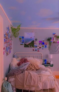 a bedroom with pictures on the wall and a bed