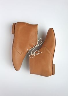 Light brown leather ankle boots. This pair is the ultimate classic, casual elegance. We made our boots to achieve comfort, durability and high aesthetics.  * Standard fit & generally runs true to size * The design is super flattering on all feet shapes and sizes * Leather lining with leather soles (3mm) & anti slip rubber heels (6mm) ✒︎ ✒︎ ✒︎ SHIPPING UPDATE (from Sept. 2022) for customers outside of Germany; if you would like to place an order for more than one pair; please place an order for each pair of shoes separately. Due to our delivery service size restriction we can only ship one pair of shoes per order (outside of Germany). Shipping to the US & UK are free. For more info please message us!  * Image no.2 is in Cognac brown colour and is for reference only.  * * * To make your orde Fall Leather Sole Lace-up Desert Boots, Leather Lace-up Chelsea Boots With Rubber Sole, Vegetable-tanned Calf Leather Boots With Round Toe, Leather Lace-up Boots With Stitched Sole For Fall, Fall Chelsea Ankle Boots With Stitched Sole, Vegetable-tanned Leather Chelsea Boots With Round Toe, Classic Medium Width Ankle Boots, Fall Chukka Boots With Rubber Sole And Calf Leather, Fall Almond Toe Lace-up Boots With Leather Sole