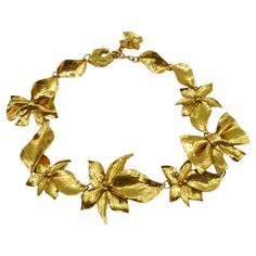 JEAN LOUIS SCHERRER vintage gold tone necklace featuring flower and bow links. Ajustable spring clasp closure. Embossed SCHERRER Paris Made in France. Indicative measurements : adjustable length from approx. 49 cm (19.29 inches) to approx 52 cm (20.47 inches) / max. width approx. 5.8 cm (2.28 inches). Material : Gold tone metal hardware. NOTES - This is a preloved vintage item, therefore it might have imperfections. - Colors may differ slightly from actual product appearance due to differences i Jean Louis Scherrer, Short Necklaces, Ribbon Jewelry, Ribbon Necklace, Bow Necklace, Metal Necklace, Designer Fashion Jewelry, Flower Jewelry, Gold Tone Necklace