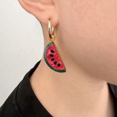 Add a slice of summer to your style with our Watermelon Hoop Earrings, the ultimate playful addition to your summer wardrobe. Laser-cut from marbled fuchsia pink and green acrylic, these lightweight earrings inject a vibrant burst of color into any outfit! Designed for all-day comfort, they're the quintessential summer accessory, perfect for beach days, festivals, or adding a fun touch to your everyday style. The watermelon charms are available to purchase on their own or can be paired with 14k gold-filled or sterling silver hoops. Handcrafted in our London studio, the watermelon earrings will arrive beautifully packaged and will make a delightful gift. Watermelon Earrings, Luxury Logo, Lightweight Earrings, Fuchsia Pink, Acrylic Earrings, Sterling Silver Hoops, Light Weight Earrings, Stylish Gifts, Beach Days