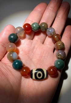 "Tibetan Agate Dzi Beads \" 2 Eyes \" Amulet Bracelet # T612766 DZI Size About : 19mm x12.9mmx10.5mm(Oblate bead) Agate Size About : 11.8mmEach Bead(Total 15 Beads) The buyers are responsible for the customs & duties if it may apply." Agate Beaded Jewelry With 8mm Beads, Round Agate 8mm Bead Jewelry, Spiritual Agate Round Bead Bracelets, Multicolor Agate Beads Jewelry 8mm, Agate Beaded Bracelets For Jewelry Making, Multicolor Agate Beaded Bracelets With Round Beads, Multicolor Agate Bracelets With 8mm Beads, Multicolor Agate Beaded Bracelets, Adjustable Amulet Beaded Bracelets With Round Beads