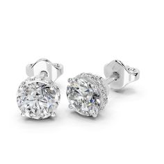 ABOUT SETTING: Round Brilliant Cut Lab Grown Diamond Halo Stud Earrings for women Setting, Featuring a timeless design that securely holds and showcases the brilliance of the solitaire diamond. ABOUT DIAMOND: These earrings feature lab-grown diamonds, guaranteeing they are sourced ethically. The size indicates the total diamond weight of the earring pair or the total weight of both diamonds. REFUND & RETURNS: Enjoy the comfort of a 30-day return policy. If you're not completely satisfied with your earrings, you can return them within 30 days for a full refund. CERTIFICATION: Each of our diamonds over 1 carat comes with an IGI certification, ensuring their quality and authenticity. Additionally, our jewelry pieces are also certified by IGI. This guarantees that you receive not only beautifu Halo Stud Earrings, Halo Earrings Studs, Solitaire Diamond, Stud Earrings For Women, Diamond Halo, 1 Carat, Diamond Solitaire, Halo Diamond, Designer Earrings