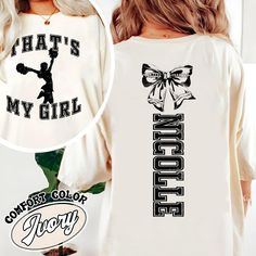 Custom That's My Girl Cheer Mom Sweatshirt, Personalized Gift For Cheer Mom Dad, Football Mom Shirt, Cheer Mom Shirt, Cheer Bows, Football Bow Hey there! A quick heads up: Our Comfort Colors Tee is a standard unisex size. If you want a cozy, oversized fit, just size up! For that trendy "T-shirt Dress" look, go up 2 sizes. Don't forget to check out our size chart to get the perfect fit! Product Details - Custom Colors Unisex 1717 Garment Dyed Tee: Made from 100% ring spun cotton Soft washed garment dyed fabric for extra comfort Double needle collar for added durability Twill taped neck and shoulders Double needle armhole, sleeve, and bottom hems Keep in mind, colors might vary a bit due to different screen settings and the handmade touch Why You'll Love It: Our special dyeing process reduce Varsity White Tops For Cheerleading, White Varsity Tops For Cheerleading, White Crew Neck Top For Cheerleading, Fall Cheerleading Top With Letter Print, White Letter Print Tops For Cheerleading, White Varsity Tops With Name Print, Customizable Cotton Cheerleading Sweatshirt, Customizable Cotton Sweatshirt For Cheerleading, Custom Print Cotton Tops For Cheerleading