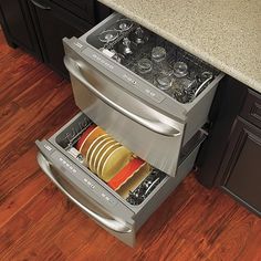 an open dishwasher drawer in a kitchen