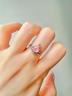 This gorgeous, timeless ring features our favorite Strawberry Quartz design and hand picked crystals.  This is a 2 piece set.  Libra is the zodiac sign of strawberry quartz. For those who are born from September 23 to October 22, things you would want to let go, such as possessiveness and indecisiveness, will disappear with the gem. The romantic within you will wake up and find opportunities to seek love when the stone is by your side. the crystal awakens new talents such as music and painting or writing. ✦ DETAILS ✦ ✧ Handcrafted  ✧ 1.25 Carat center stone ✧ Strawberry Quartz and crystals  ✧ Sizes 3.75-11.25 ✧ This ring will arrive ready to gift in a Kherish Jewelry Pouch. ✧ PRE-ORDER: Items that are preorder only will ship within 10-15 business days.  You will receive an email with the u Pink Elegant Crystal Ring For Valentine's Day, Elegant Pink Crystal Ring For Valentine's Day, Pink Morganite Gemstone Jewelry, Pink Morganite Rings For Gift, Pink Morganite Rings Perfect As Gifts, Pink Morganite Jewelry For Gift, Pink Morganite Jewelry Gift, Pink Morganite Jewelry As A Gift, Pink Rose Quartz Jewelry With Stones