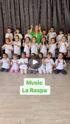 a group of children posing for a photo in front of a backdrop with music la raspa written on it