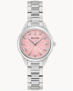 Add a pop of color to your wardrobe with the Bulova Women's D11 Bracelet Watch, featuring a vibrant pink dial that captures attention and exudes feminine charm. With its polished stainless steel construction and precise craftsmanship, this stylish timepiece is both versatile and elegant. Dial and Case: The eye-catching pink dial is framed by a sleek stainless steel case, creating a radiant contrast that adds a bold yet refined look to your wrist. Luminous hands and hour markers ensure visibility, while the date window provides practical functionality. Bracelet: The stainless steel bracelet combines polished and brushed finishes, delivering a comfortable and secure fit that complements the watch's sophisticated aesthetic. Movement: Powered by a high-quality quartz movement, this watch offer Classic Pink Watch With Round Dial, Formal Pink Diamond Watch With Diamond Hour Markers, Modern Pink Round Dial Watches, Modern Pink Analog Watch, Pink Watch With Diamond Hour Markers, Classic Pink Round Watch, Pink Diamond Watch With Diamond Hour Markers, Pink Watches With Diamond Hour Markers, Pink Round Watches With Subdials