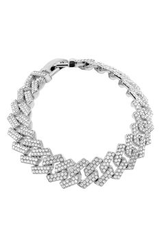 Pavé cubic zirconia bring glamorous sparkle to a curb-chain bracelet with a polished rhodium-plated finish. 8 1/2" length; 1/2" width Fold-over clasp White rhodium plate/cubic zirconia Imported Silver Cuban Link Jewelry With Rhinestones, Iced Out Crystal Chain Link Jewelry, White Gold Cubic Zirconia Chain Link Bracelet, Iced Out White Gold Metal Jewelry, Iced Out Cuban Link Bracelets For Party, Iced Out Cuban Link Bracelet For Party, Formal Curb Chain Bracelet In Cubic Zirconia, Formal Cubic Zirconia Bracelets With Curb Chain, Silver Cubic Zirconia Chain Tennis Bracelet