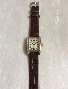 Vellacio silver women's watch, having a rectangle mother of pearl dial, displaying easy to read roman numeral hours, all on a brown leather strap band! this is a unused still new vintage watch, ready to keep you up with accurate time! measurements: bezel/case 1 1/8" x 3/4" rectangle, dial 3/4" x 5/8" rectangle, band width 1/2" and fits perfectly a 5 1/2" up to a 7 1/2". we ship fast, the next business day, for a quick delivery to you! may you have a wonderful time shopping, best wishes! Silver Watches Women, A Rectangle, Roman Numeral, Brown Leather Strap, Women's Watch, Roman Numerals, Quick Delivery, Leather Band, Wonderful Time