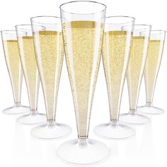 six champagne flutes are lined up in a row